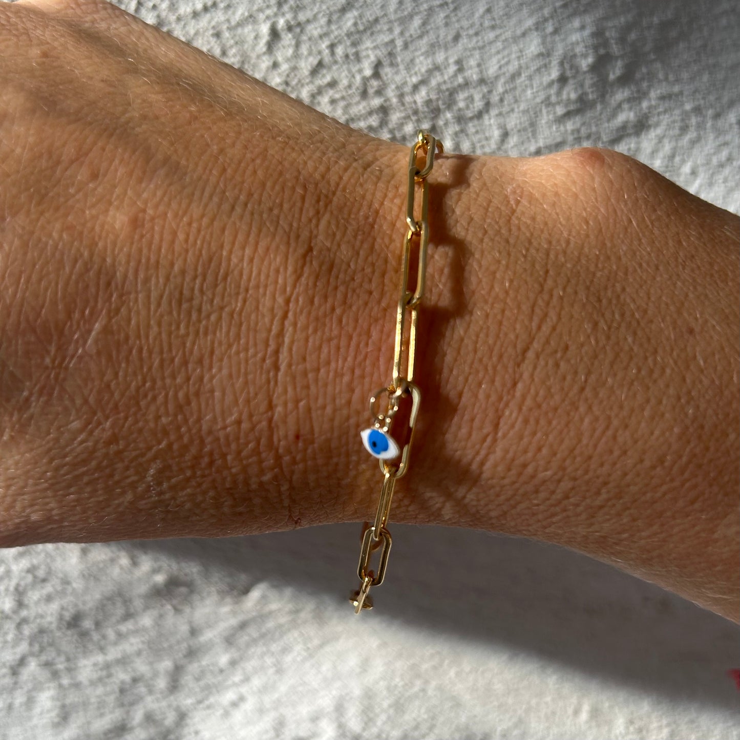 Paper clip chain bracelet with 14k gold evil eye pendant